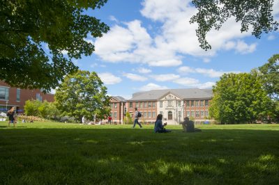 Students walking across the Student Union Mall with the Castleman (Engineering) Building in the background on Aug. 29, 2014. (Sean Flynn/UConn Photo)